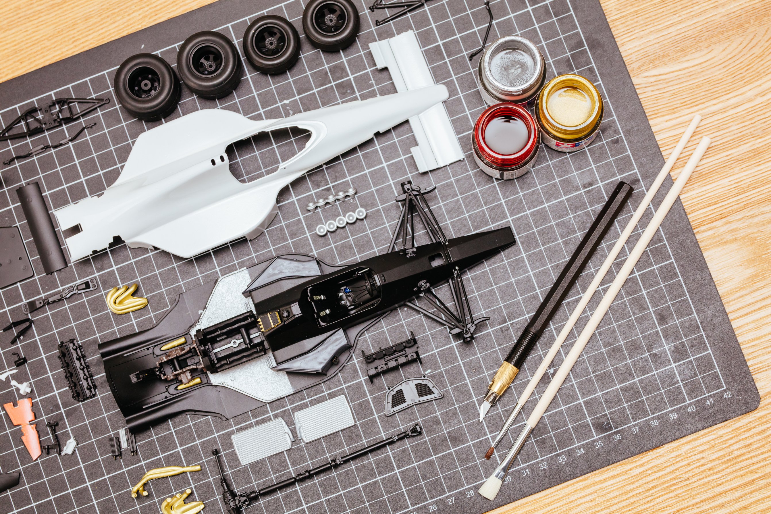 Toy Model Car Parts on a Desk